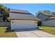 Charming home featuring a two-car garage and manicured front lawn at 3605 S Saint Lucie Dr, Casselberry, FL 32707