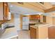 Kitchen featuring modern appliances, a pantry, and a serving bar to the adjacent living area at 3605 S Saint Lucie Dr, Casselberry, FL 32707