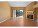 Spacious living room with wood floors, fireplace, and sliding glass doors at 3605 S Saint Lucie Dr, Casselberry, FL 32707