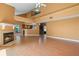 Open-concept living room featuring a fireplace and views into the kitchen at 3605 S Saint Lucie Dr, Casselberry, FL 32707
