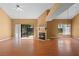 Bright living room with wood floors, fireplace, and sliding glass doors to the backyard at 3605 S Saint Lucie Dr, Casselberry, FL 32707