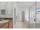 Bathroom featuring double sinks, a soaking tub, and a glass-enclosed shower at 3747 Moon Dancer Pl, St Cloud, FL 34772