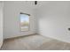 Bright bedroom featuring carpeted floors and a window with wood-look blinds at 3747 Moon Dancer Pl, St Cloud, FL 34772