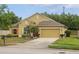 Charming single-story home with stucco exterior, two-car garage, and well-manicured lawn at 3747 Moon Dancer Pl, St Cloud, FL 34772
