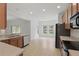 Well-lit kitchen with stainless steel appliances, ample cabinetry, and an adjacent dining area at 3747 Moon Dancer Pl, St Cloud, FL 34772