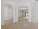 Open-concept living room with neutral paint, carpet, archways, recessed lighting, and sliding glass door at 3747 Moon Dancer Pl, St Cloud, FL 34772