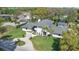 Beautiful aerial view of a modern home with a large backyard, pool, and manicured lawn at 409 W 2Nd Ave, Windermere, FL 34786