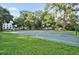 Outdoor basketball court surrounded by lush greenery, providing a great space for sports and recreation at 409 W 2Nd Ave, Windermere, FL 34786