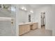 Open concept bathroom with marble tiled walk-in shower and a double sink vanity at 409 W 2Nd Ave, Windermere, FL 34786