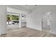 Well-lit bedroom features neutral walls, hardwood floors and a built-in desk beneath a window at 409 W 2Nd Ave, Windermere, FL 34786