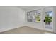 Inviting room with light-colored floors, bright white walls, and access to an outdoor view through a glass door at 409 W 2Nd Ave, Windermere, FL 34786