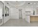 Elegant dining area with modern chandelier and large window, bathed in natural light at 409 W 2Nd Ave, Windermere, FL 34786
