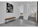 Welcoming entryway showcasing bench seating, modern art, and an open floorplan with plenty of natural light at 409 W 2Nd Ave, Windermere, FL 34786