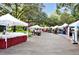 Vibrant outdoor farmer's market with numerous vendors and tents, offering fresh produce and local goods at 409 W 2Nd Ave, Windermere, FL 34786