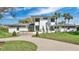 Stunning modern home with unique architectural details, mature landscaping and a circular driveway at 409 W 2Nd Ave, Windermere, FL 34786