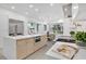 Modern kitchen featuring stainless steel appliances, a large island, and an adjacent dining area at 409 W 2Nd Ave, Windermere, FL 34786