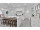 Modern kitchen with an island, breakfast bar, stainless steel appliances, and bright white cabinets at 409 W 2Nd Ave, Windermere, FL 34786