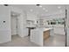 Bright kitchen with quartz counters, stainless steel appliances, and light wood accents at 409 W 2Nd Ave, Windermere, FL 34786