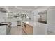 Modern kitchen featuring stainless steel appliances, a large island, and ample counter space at 409 W 2Nd Ave, Windermere, FL 34786