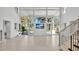 Spacious living room with floor-to-ceiling windows and access to the outdoor area at 409 W 2Nd Ave, Windermere, FL 34786
