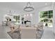 Open living area featuring high ceilings, modern furniture, and large windows with natural light at 409 W 2Nd Ave, Windermere, FL 34786
