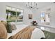 Main bedroom showcasing a large window view of the pool and manicured backyard at 409 W 2Nd Ave, Windermere, FL 34786