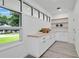 Well-lit mudroom featuring custom cabinetry, butcher block countertops, and floating shelves at 409 W 2Nd Ave, Windermere, FL 34786