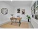 Home office with modern decor, a rustic desk, and a large window for ample natural light at 409 W 2Nd Ave, Windermere, FL 34786