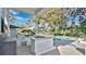 Outdoor kitchen with a built-in grill and a large countertop bar next to the inviting swimming pool at 409 W 2Nd Ave, Windermere, FL 34786