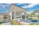 Spacious outdoor living area featuring a fireplace, kitchen and pool at 409 W 2Nd Ave, Windermere, FL 34786