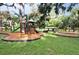 Well-maintained playground with slides, climbing structures, and a picnic pavilion, perfect for Gathering fun at 409 W 2Nd Ave, Windermere, FL 34786
