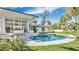 Lush greenery frames the relaxing pool and spa area of this home at 409 W 2Nd Ave, Windermere, FL 34786