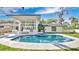 An inviting pool area featuring a jacuzzi and entertainment space at 409 W 2Nd Ave, Windermere, FL 34786