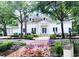 Charming Town Hall building with classic architecture, set amidst beautiful landscaping and colorful flower beds at 409 W 2Nd Ave, Windermere, FL 34786