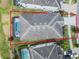 Overhead view of a home highlighting the screened pool area, lawn, and overall property layout at 418 Marcello Blvd, Kissimmee, FL 34746