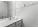 Well-lit bathroom with a single sink vanity and neutral colors at 418 Marcello Blvd, Kissimmee, FL 34746