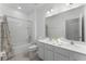 The bathroom featuring modern fixtures, a vanity with dual sinks, toilet, and a shower-tub combination at 418 Marcello Blvd, Kissimmee, FL 34746