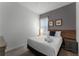 Bedroom featuring one bed, art work, and window with coverings at 418 Marcello Blvd, Kissimmee, FL 34746
