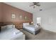 Bedroom featuring two beds, warm color accents and natural light, perfect for guests or Gathering at 418 Marcello Blvd, Kissimmee, FL 34746