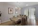 Formal dining area with stylish lighting fixture and neutral décor at 418 Marcello Blvd, Kissimmee, FL 34746