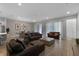 Spacious living area with lots of natural light, opening to the kitchen and dining area at 418 Marcello Blvd, Kissimmee, FL 34746