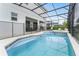 Expansive screened-in pool area with ample seating, seamlessly connected to the home’s patio, ideal for outdoor entertaining and leisure at 418 Marcello Blvd, Kissimmee, FL 34746