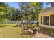Backyard with mature landscaping and a barbecue grill at 4424 Park Eden Cir, Orlando, FL 32810