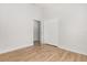 Empty bedroom featuring wood-look floors and a doorway to an adjoining room at 4424 Park Eden Cir, Orlando, FL 32810