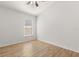 Bright bedroom featuring wood-look floors, a ceiling fan, and a window at 4424 Park Eden Cir, Orlando, FL 32810