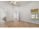 Spacious bedroom with wood floors, ample natural light, and ensuite bathroom access at 4424 Park Eden Cir, Orlando, FL 32810