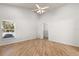 Bright bedroom features vaulted ceilings, wood floors, and a walk-in closet at 4424 Park Eden Cir, Orlando, FL 32810