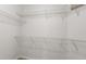 Walk-in closet featuring wire shelving, providing optimal storage solutions at 4424 Park Eden Cir, Orlando, FL 32810