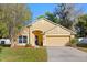 Inviting single-Gathering home with a well manicured lawn and two car garage at 4424 Park Eden Cir, Orlando, FL 32810