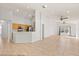 Open-concept living room with tile flooring, kitchen, and abundant natural light at 4424 Park Eden Cir, Orlando, FL 32810